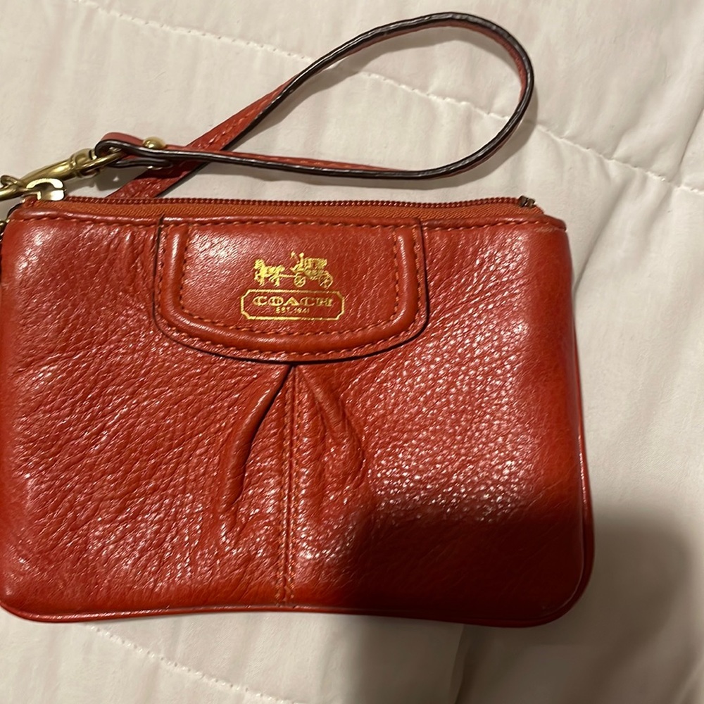 Coach orange leather wristlet gently used !